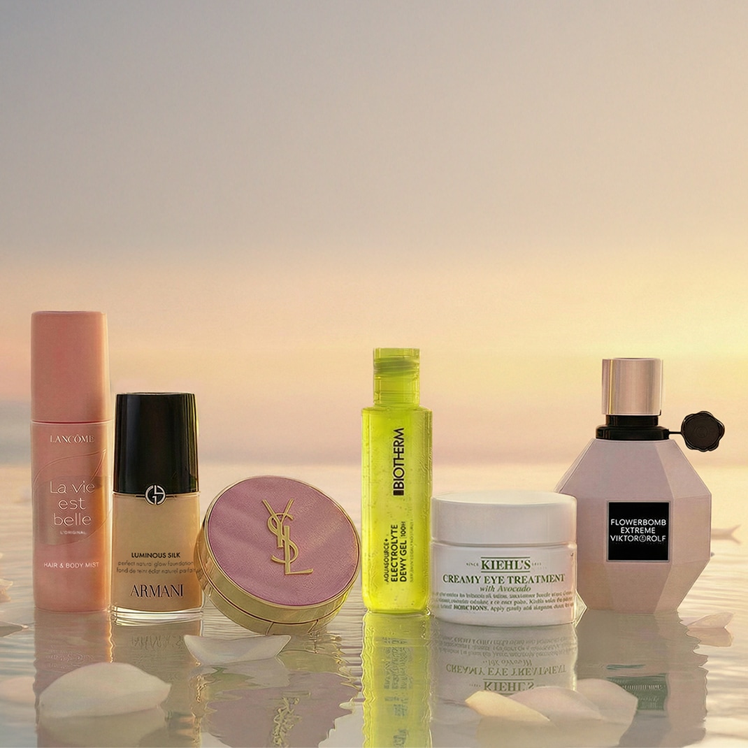 Discover a curated collection of beauty essentials, featuring Lancôme's La Vie Est Belle hair and body mist, Armani's Luminous Silk foundation, and Yves Saint Laurent's iconic compact.