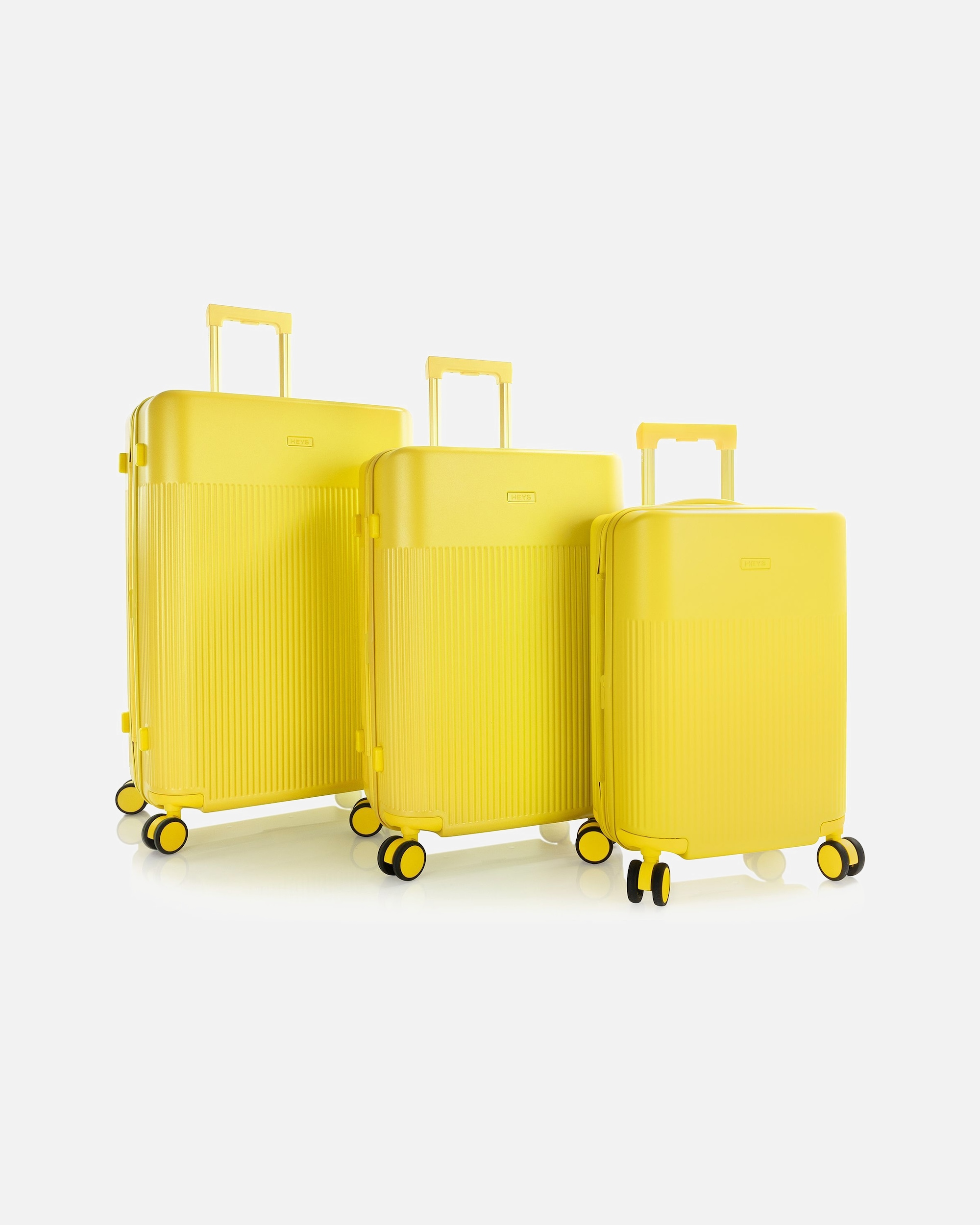 Koffer für Männlich Heys HiLite 4 Rollen Kofferset 3-teilig mit Dehnfalte sunburst yellow